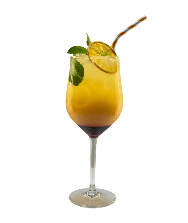 Refreshing tropical cocktail with lemon, mint, and straw in a tall glass.