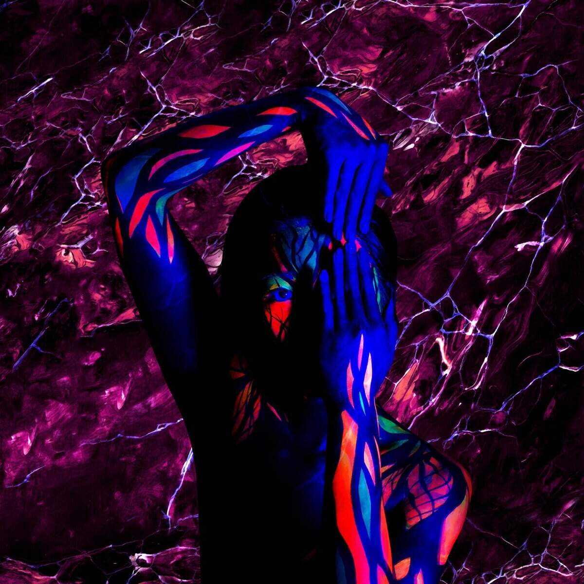 Vibrant neon-lit figure with body paint at Shisha Lounge Nijmegen, near Waalkade.